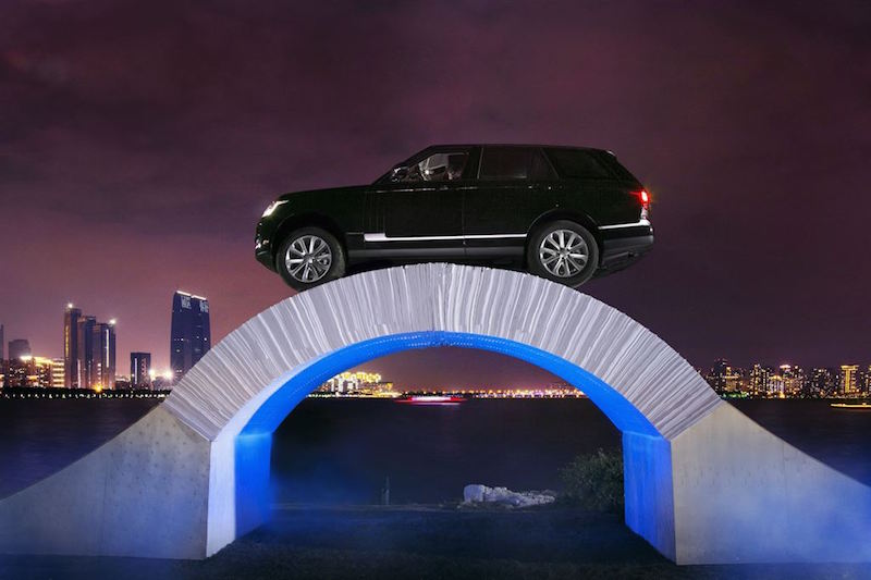 Range Rover over paper bridge