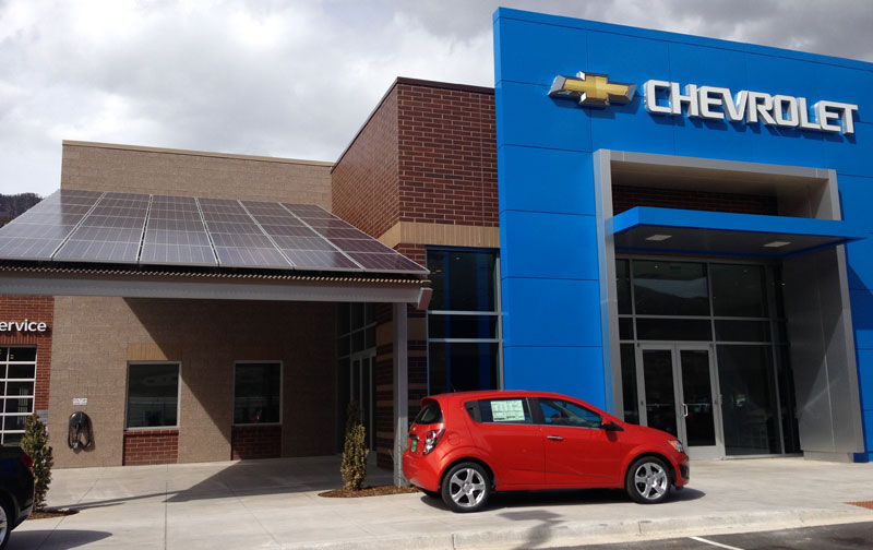 Mountain Chevrolet dealership is powered by 40 kilowatts of solar energy from a rooftop array and solar canopy over an EV charging station