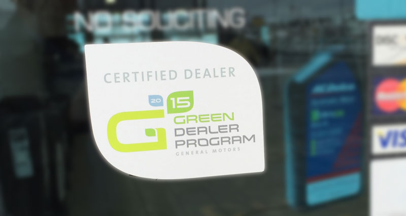 GM Green Dealer certification label at a dealership
