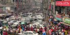 A traffic jam with lots of cars and people